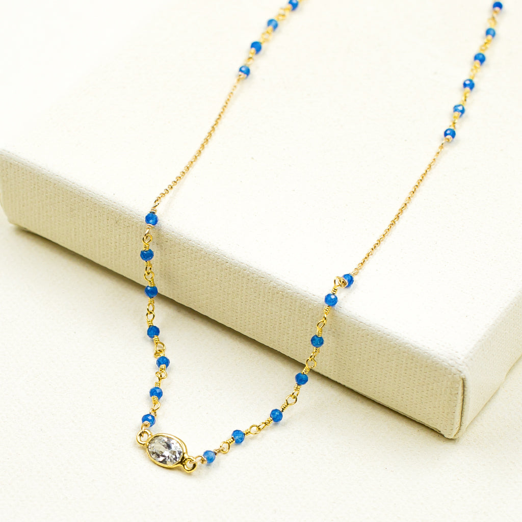 faceted blue onyx and cubic zirconia crystal on gold chain