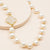 faceted milky white chalcedony clover quadrafoil pendant on freshwater white pearl bead classic style necklace