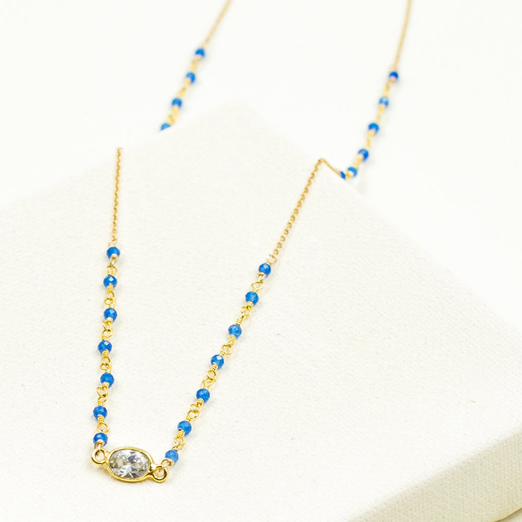 faceted blue onyx and cubic zirconia crystal on gold chain
